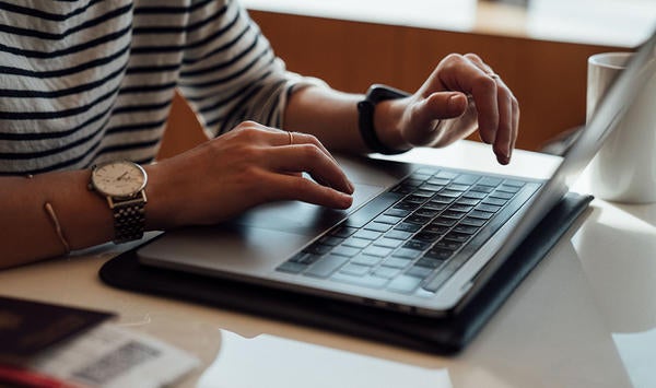 hands at a laptop (c) Etienne Boulanger unsplash